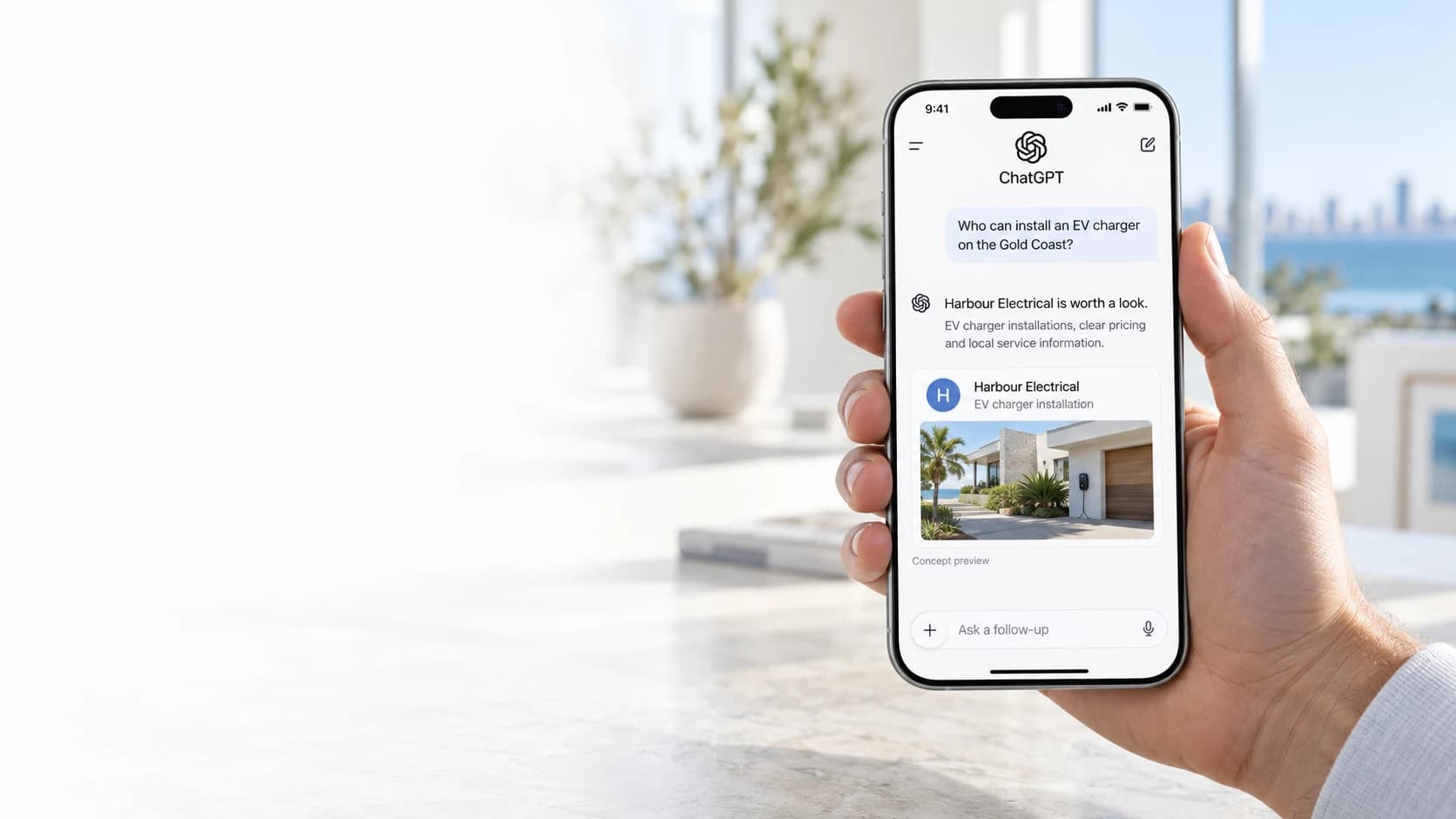 A phone showing a concept ChatGPT conversation recommending fictional Harbour Electrical for an EV charger installation