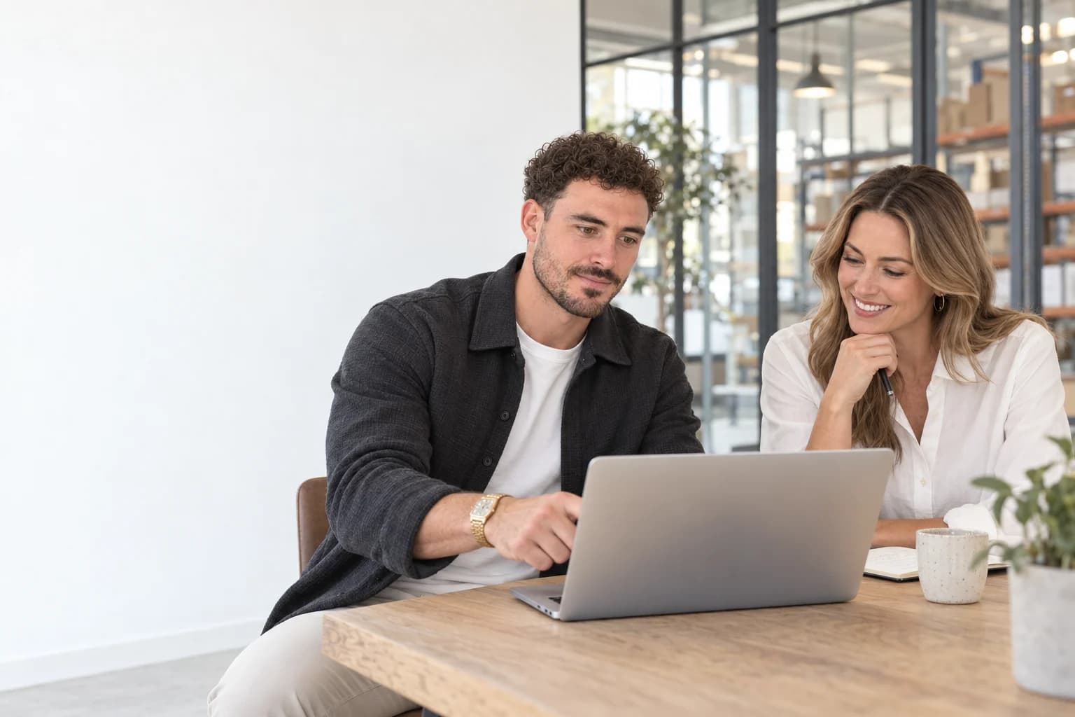 Illustrative scene of Clayton reviewing a website with a business owner